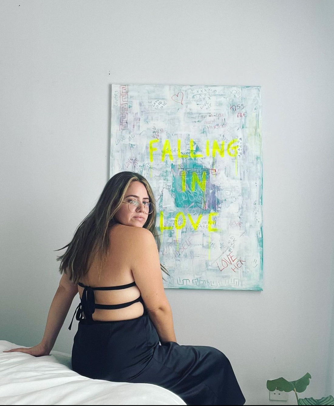 Artist with her original contemporary artwork